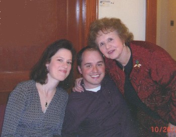 Joan Williams greets Russell and Jessica Lester.